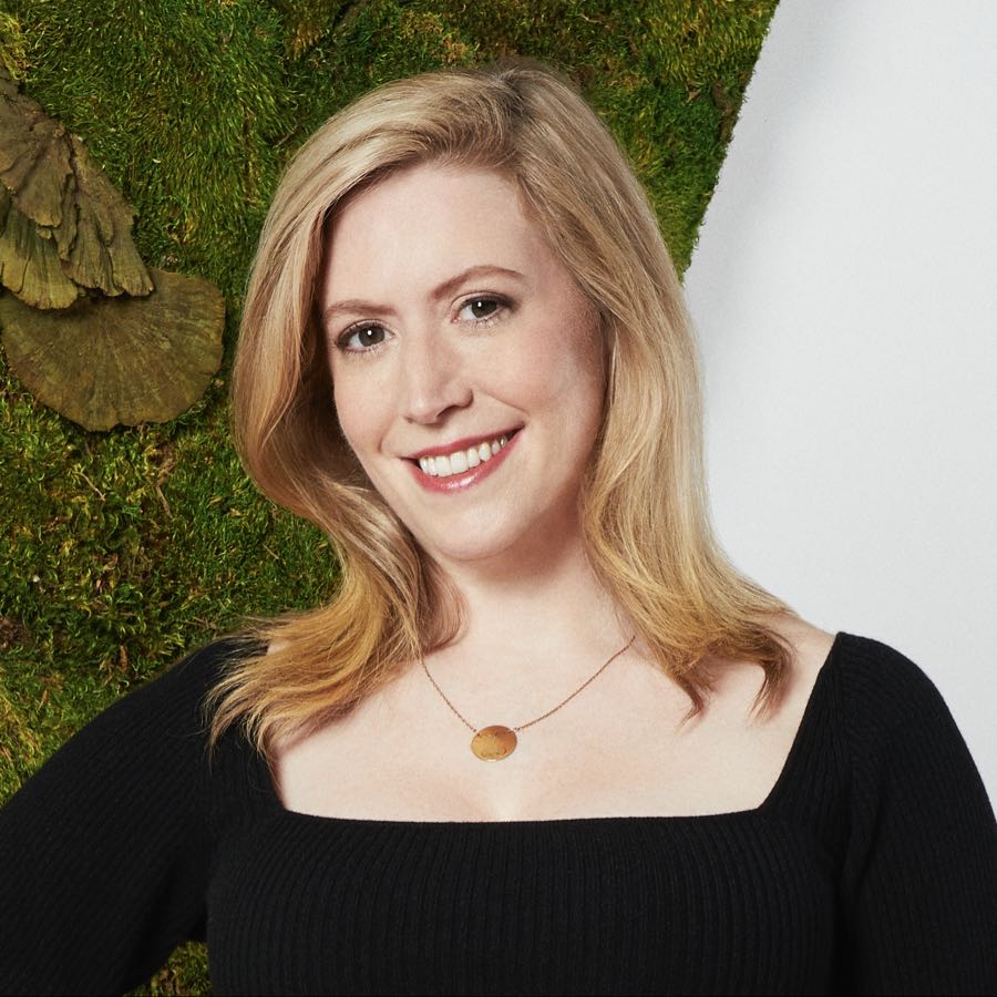 Kate Twist pictured in front of a green moss wall