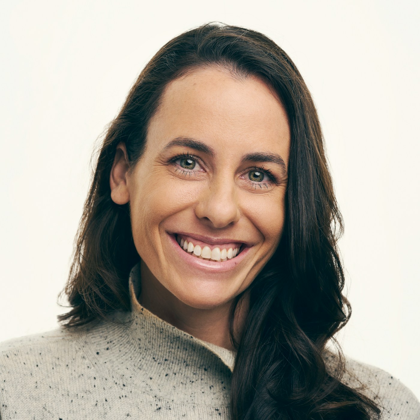 Portrait of Kathy Hannun in a gray sweater against a light background