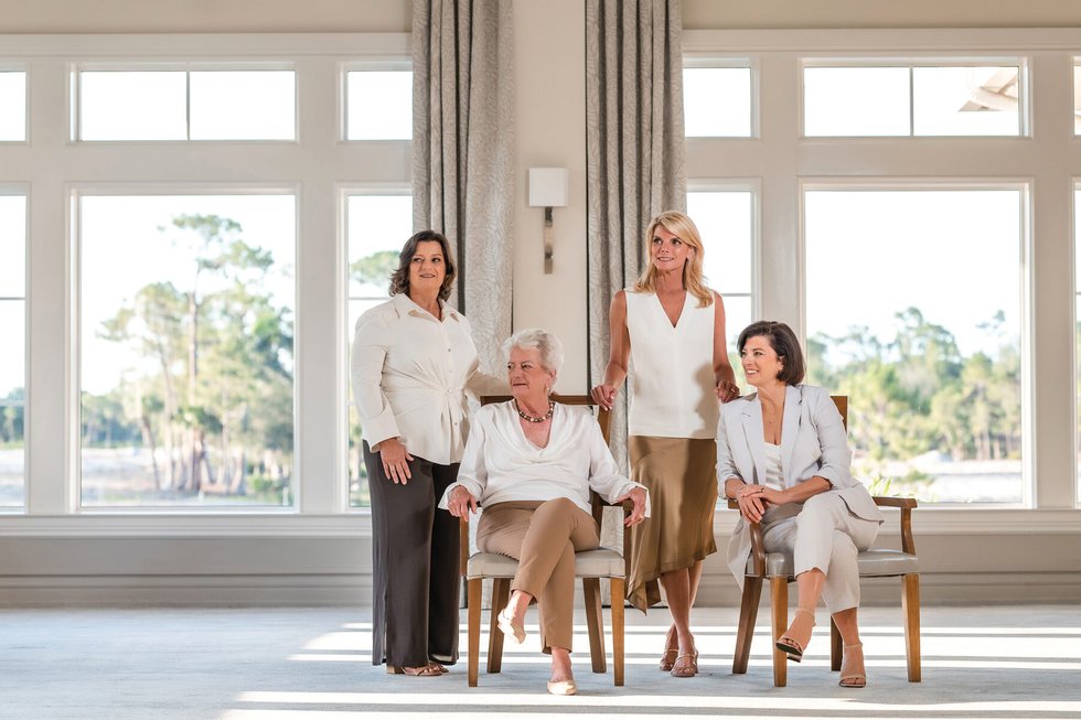 Judy Sproul and her three daughters photographed together in a bright room