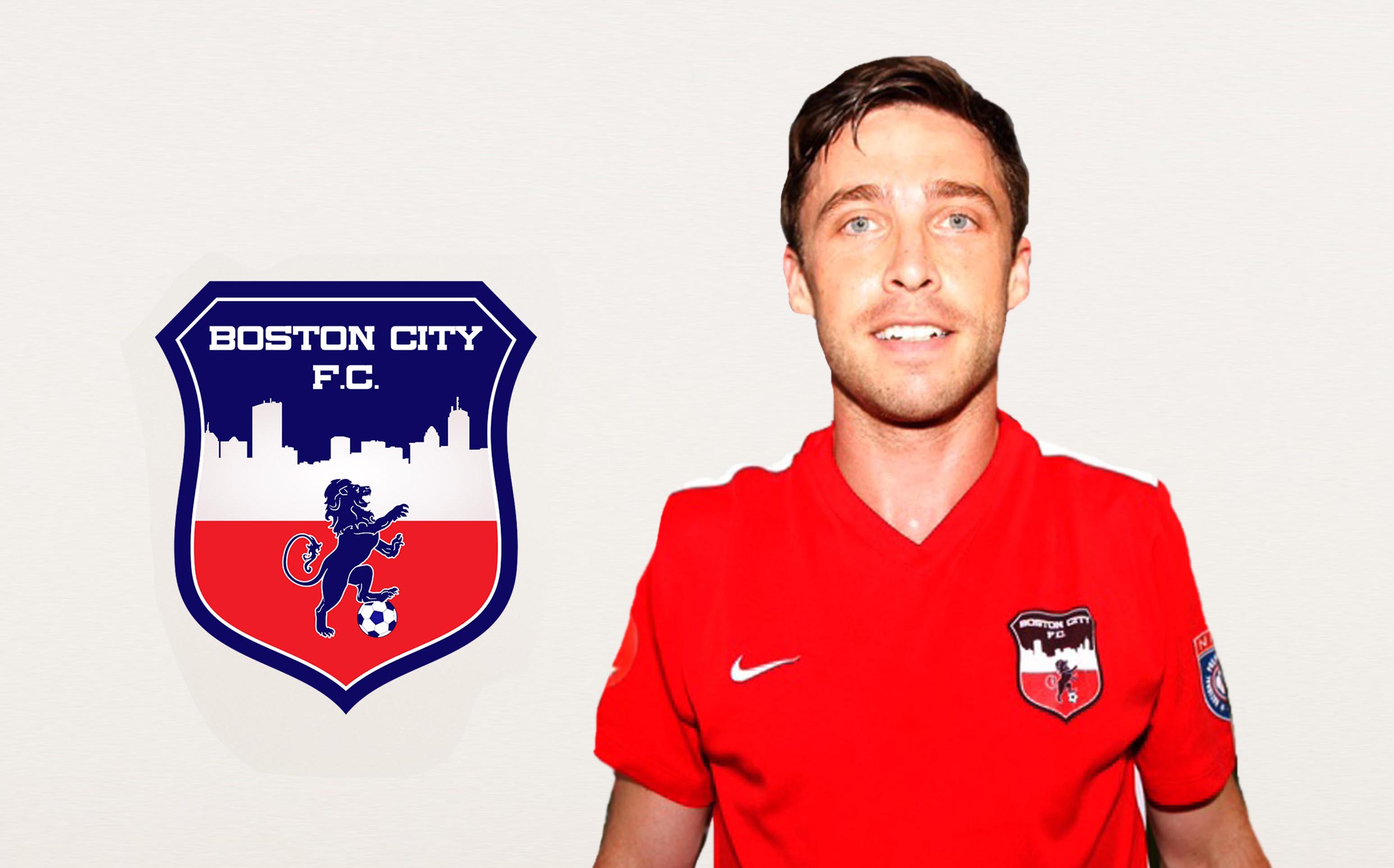 Keith Caldwell wearing a red Boston City FC jersey in the club’s player photograph