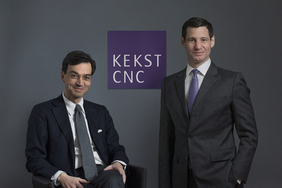 Kekst and CNC leaders with the combined firm's purple sign in 2018
