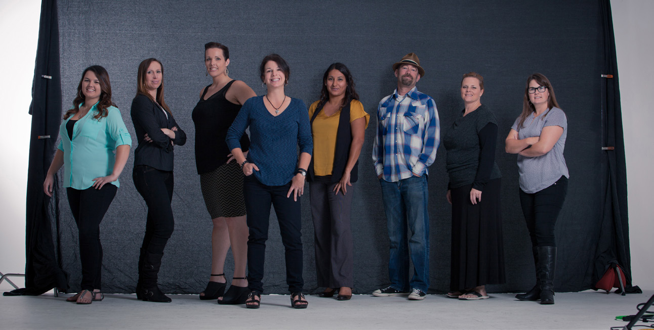 Kellie Searle, fourth from left, with seven members of the Searle Creative team in an archival group photograph