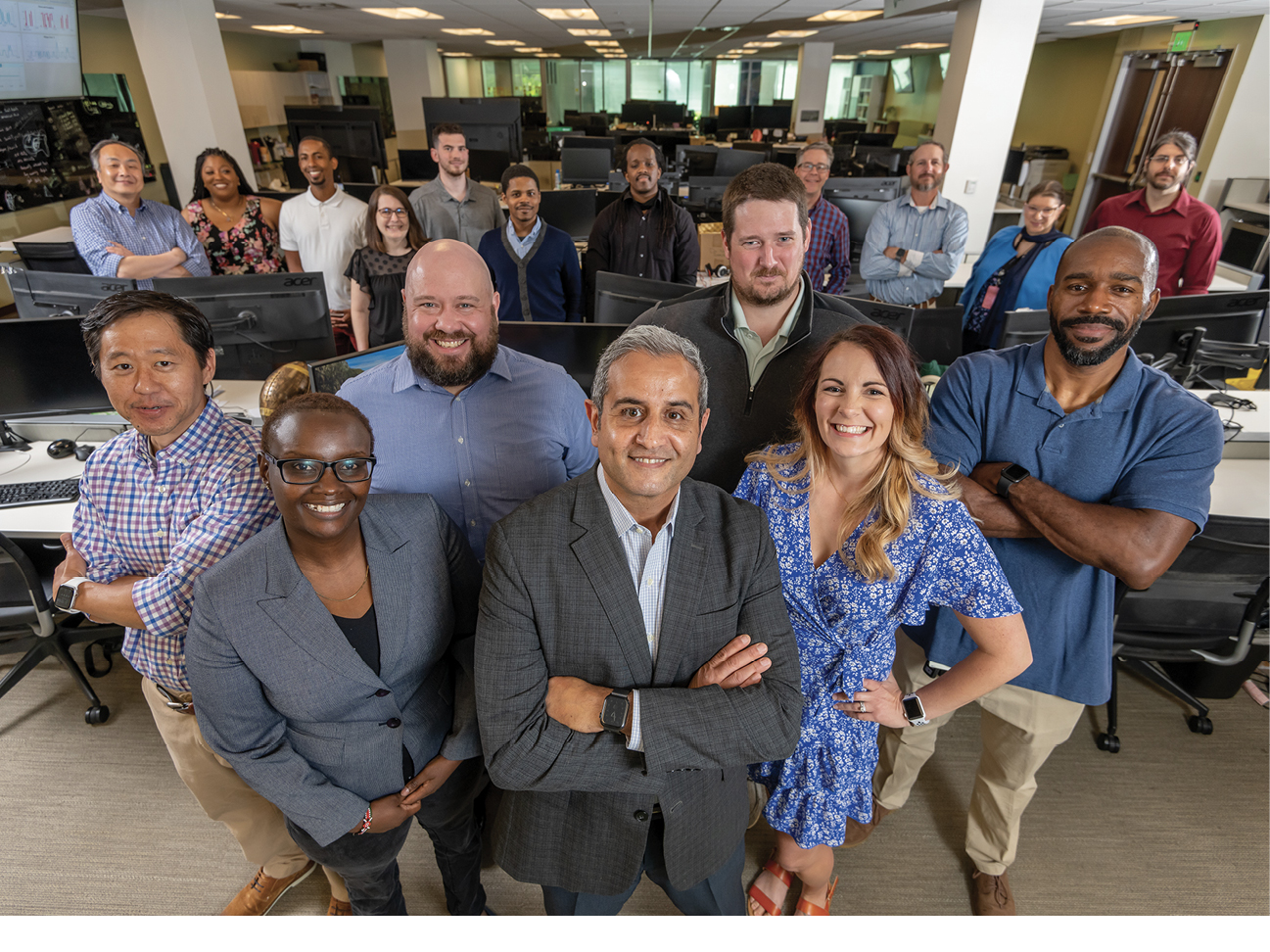 Members of Kelly Benefits’ technology team in their office in 2021