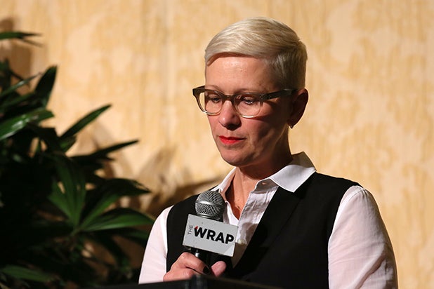 Kelly Bush Novak speaking into a microphone at the 2017 Power Women Breakfast in Los Angeles