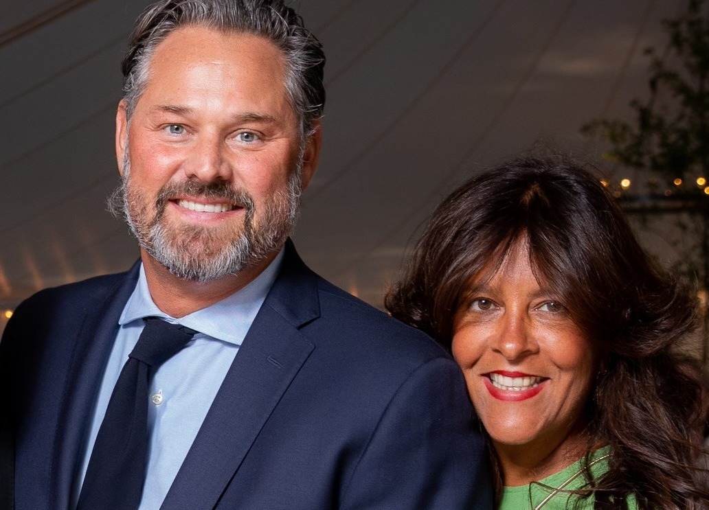 Ken and Christine Begasse smiling together in a photograph published by Providence College