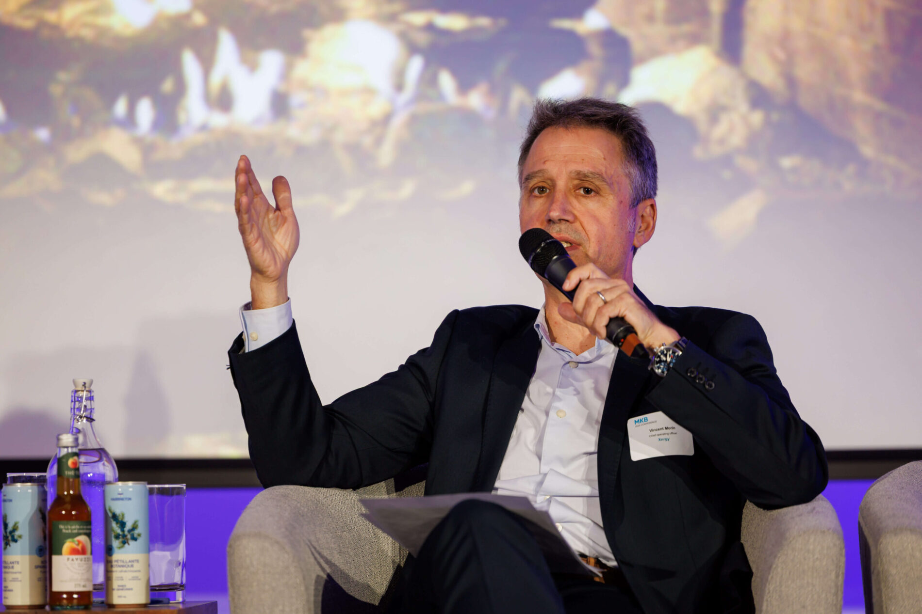 XNRGY chief operating officer Vincent Morin speaks into a microphone at MKB’s 2025 annual meeting