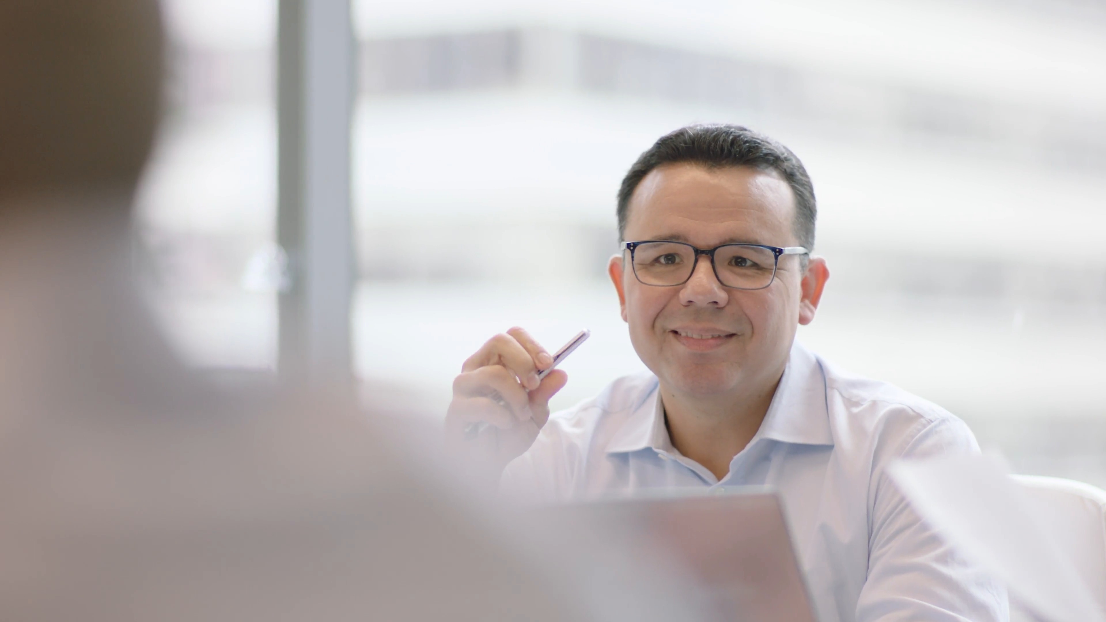 Ken Spain seated at a conference table during a Narrative Strategies work session