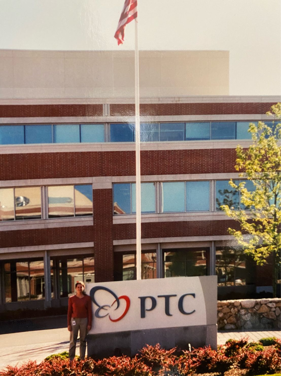 Kendra Seaman standing beside the PTC sign in 2001