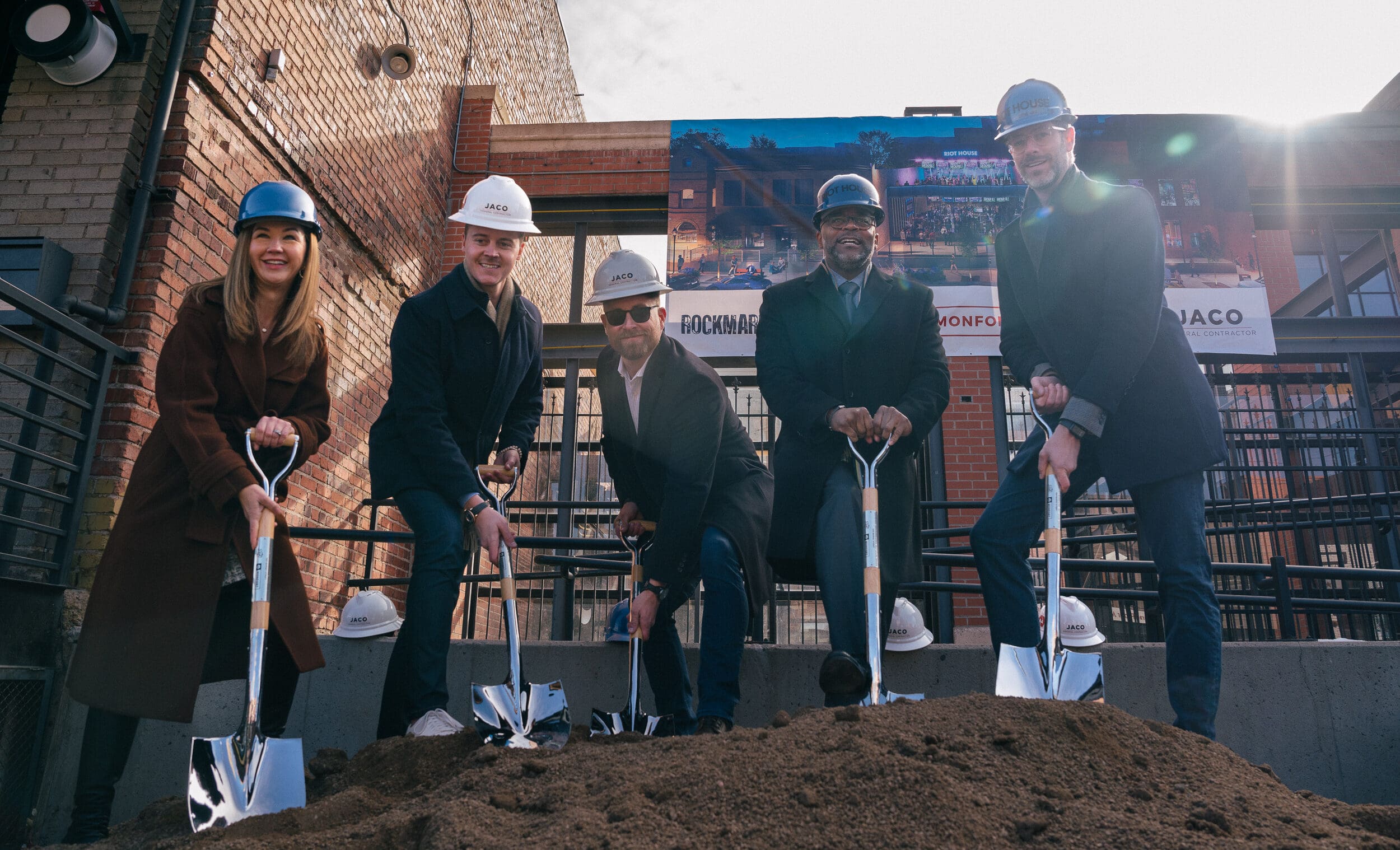 Kenneth Monfort and project participants holding ceremonial shovels at the Riot House groundbreaking