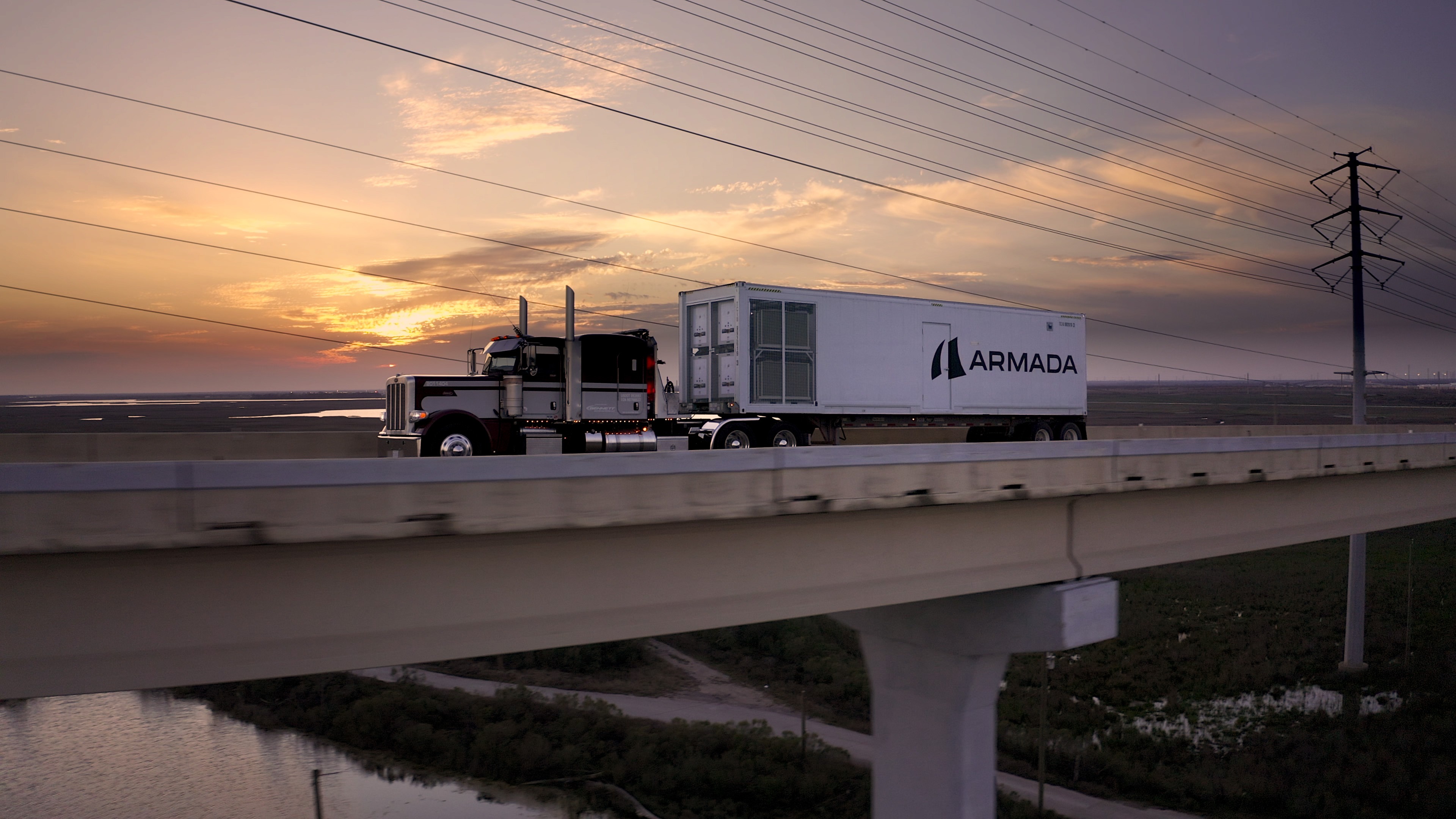 An Armada Triton modular data center being transported on a flatbed trailer