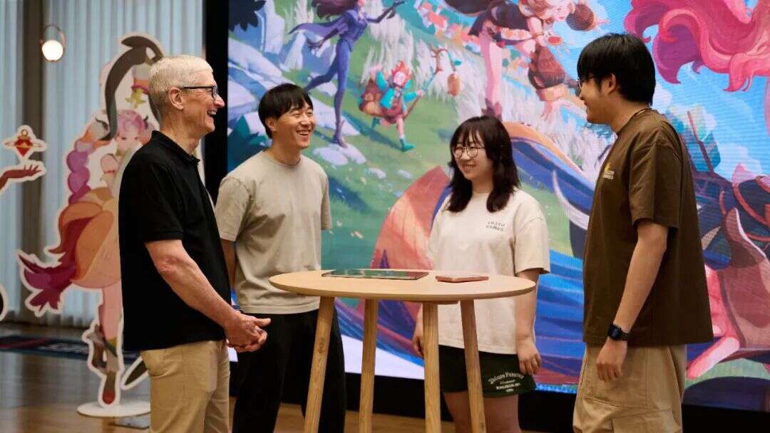 Tim Cook with Kenny Wang and two members of the AFK Journey team at Lilith in October 2025