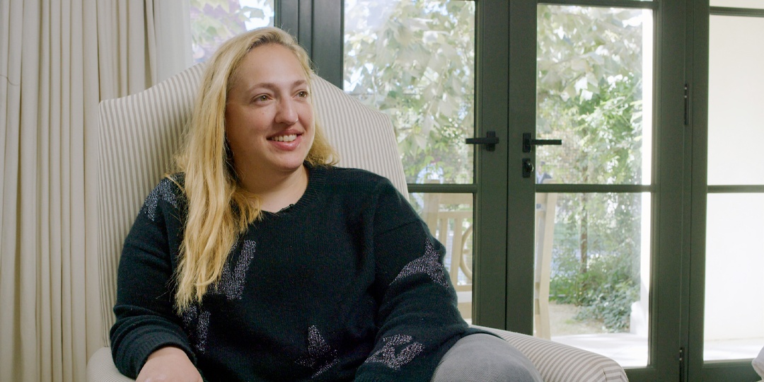 Keri Findley seated by a window during an Opto video interview