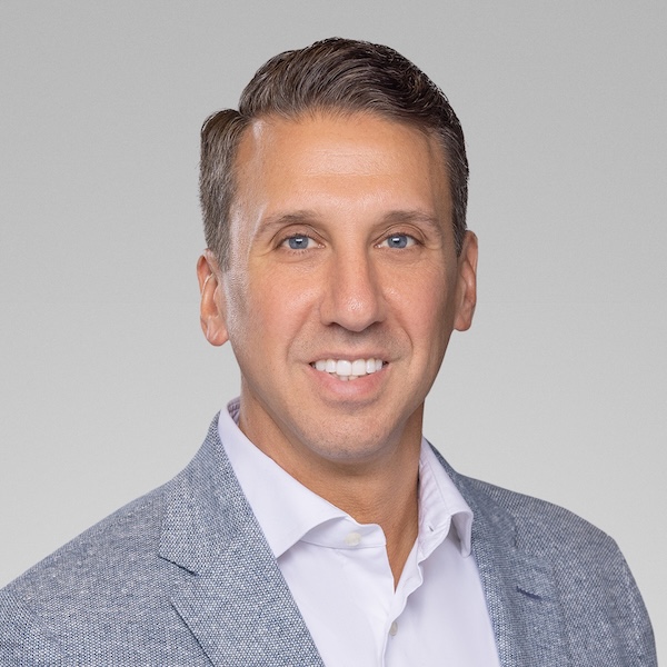 John Amore, president of Kestra Financial, in a gray jacket
