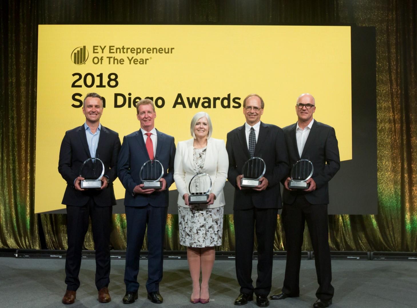 Five recipients holding trophies at the EY Entrepreneur Of The Year 2018 San Diego Awards