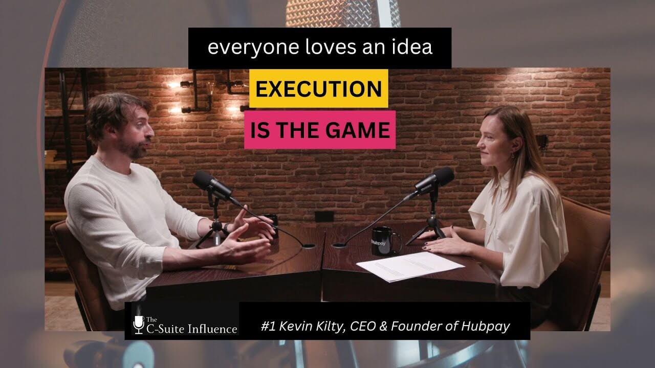 Kevin Kilty speaking with Lara Varlamova at a podcast recording table