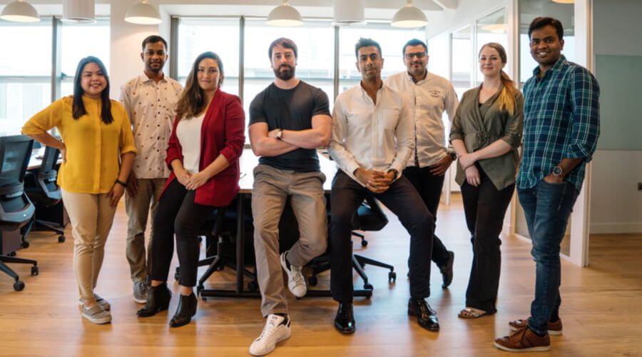 Kevin Kilty, fourth from left, with colleagues in the Hubpay office