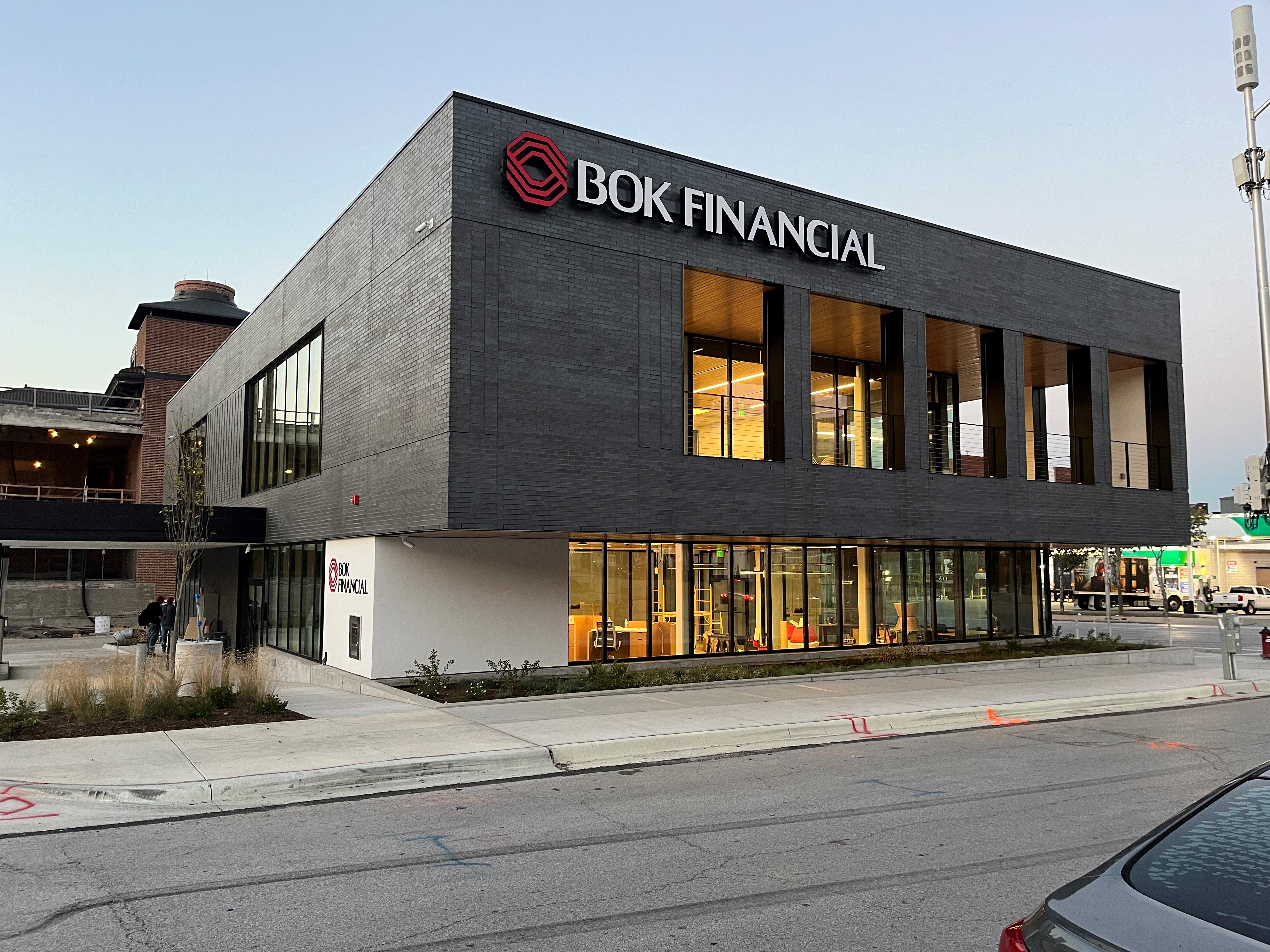 Dark brick and glass exterior of BOK Financial’s banking center at 1707 Grand Boulevard in Kansas City