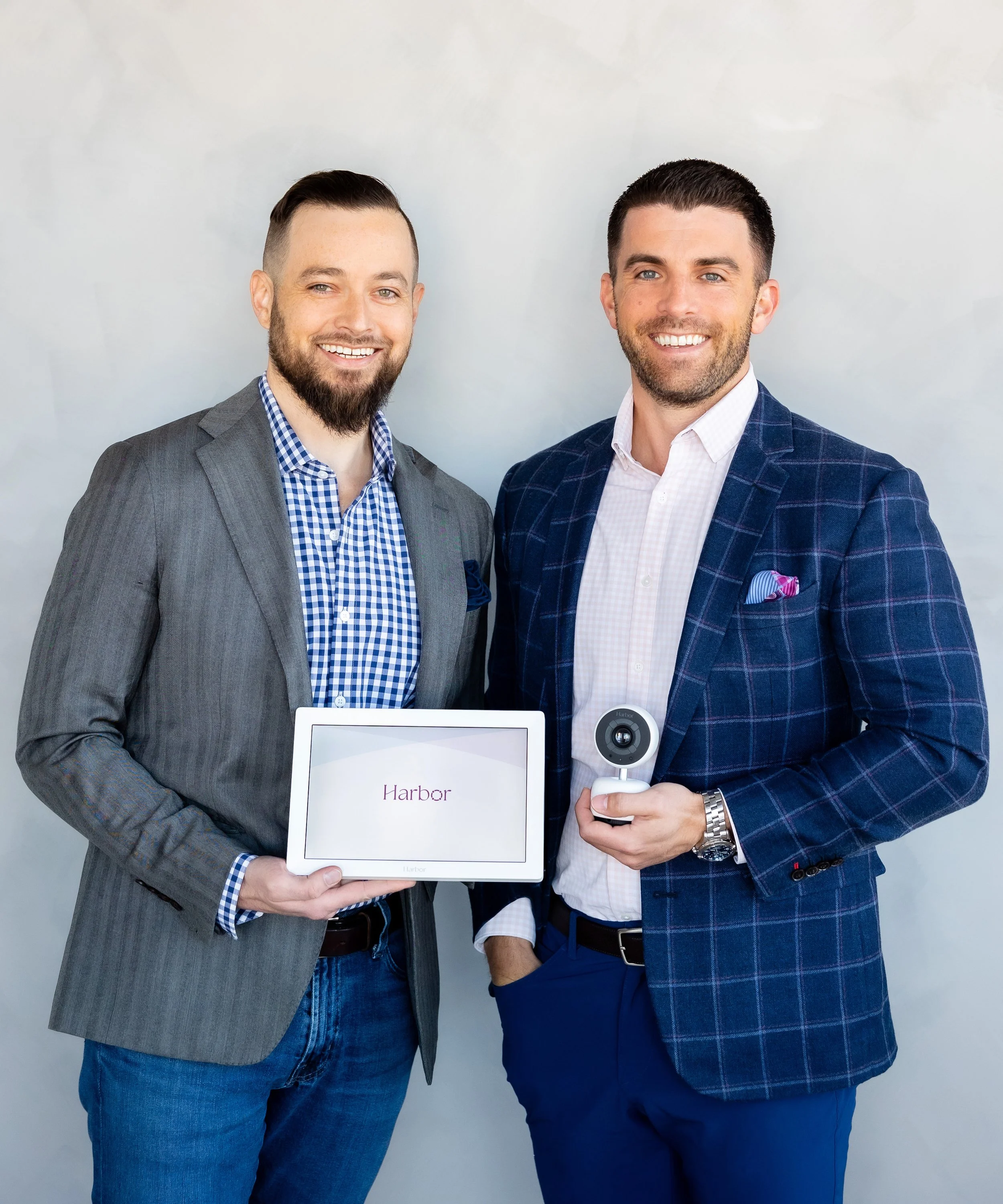Harbor cofounders Charlie Hill, left, and Kevin Lavelle, right, holding the monitor and camera