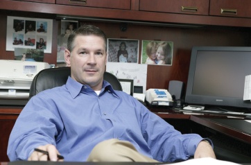 Kevin McMurtry seated at his office desk in a 2005 photograph