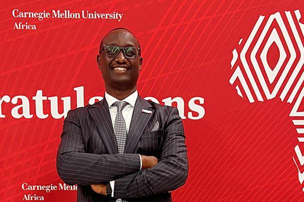Kevin Rudahinduka standing at a Carnegie Mellon University Africa event
