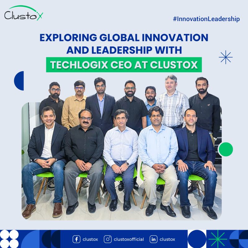 Kewan Khawaja seated in the center of the front row with participants at a Clustox gathering