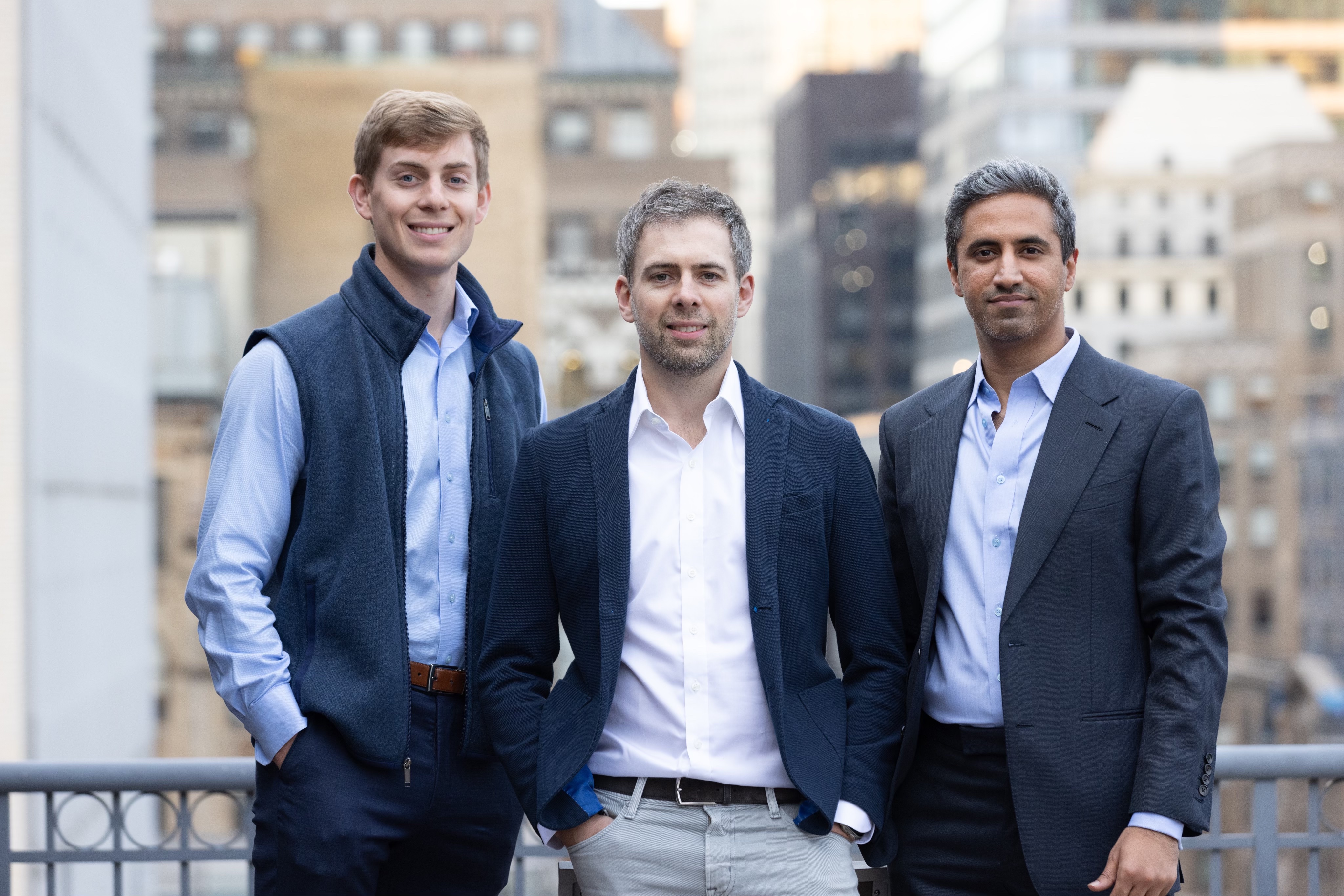 Keychain co-founders Jordan Weitz, Oisin Hanrahan and Umang Dua standing together on a New York rooftop
