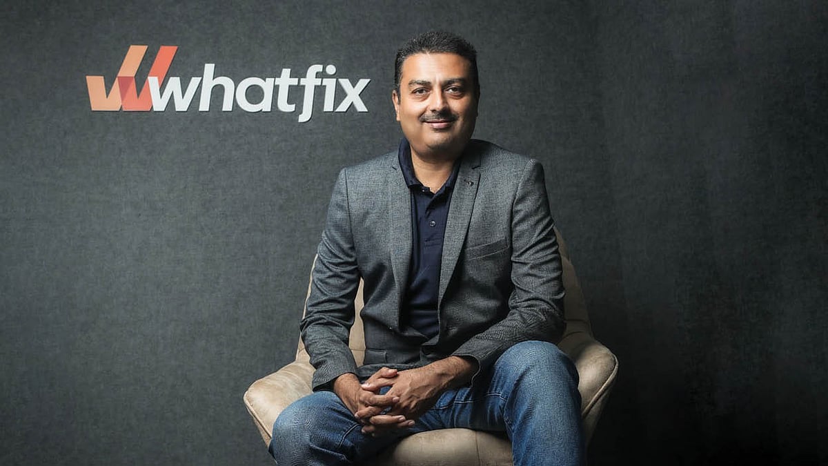 Khadim Batti seated beside the Whatfix wordmark