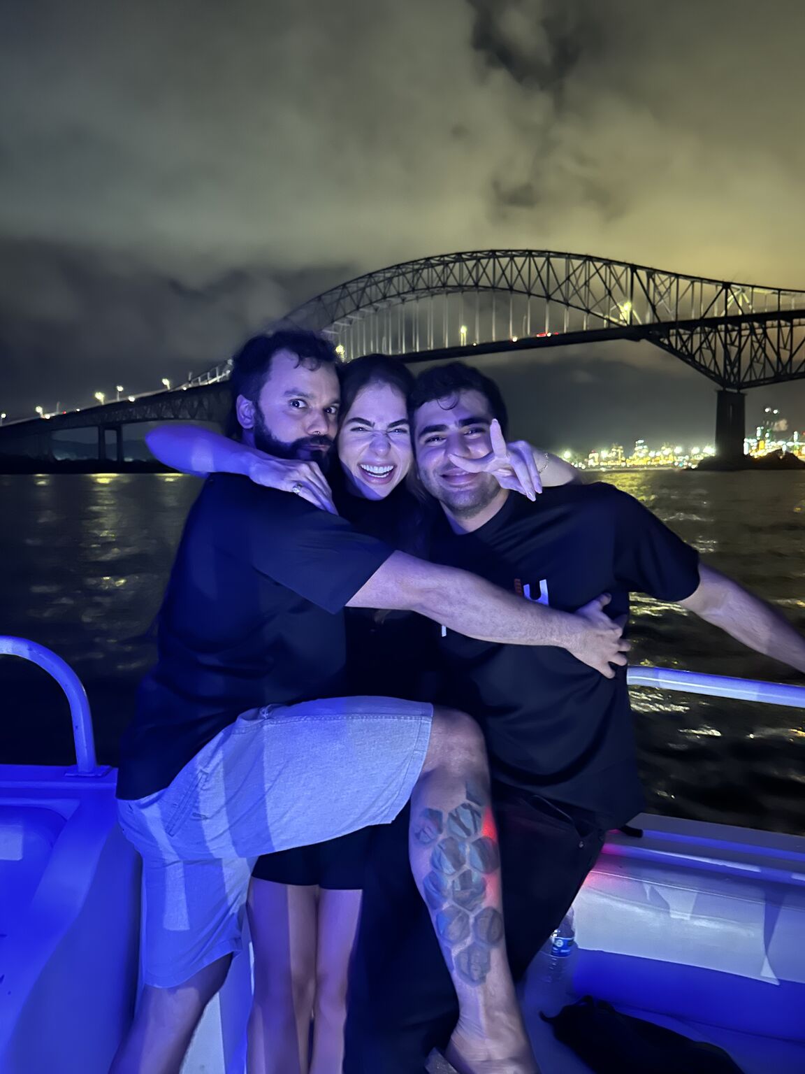 Khaled Alhaj, at right, with Munily cofounders Marwa Hage and Mitchell Contreras on a boat at night