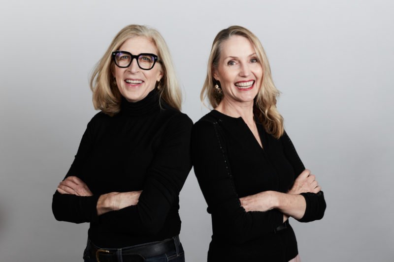 KIKOKO founders Jennifer Chapin and Amanda Jones seated together outdoors