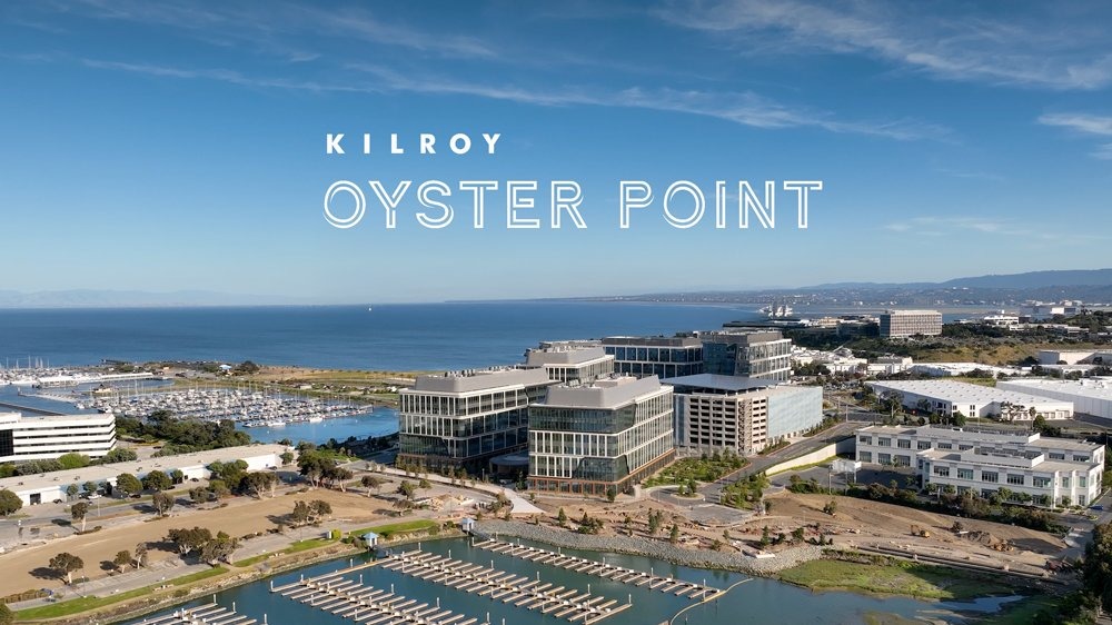 Kilroy Oyster Point’s glass buildings beside a marina on San Francisco Bay