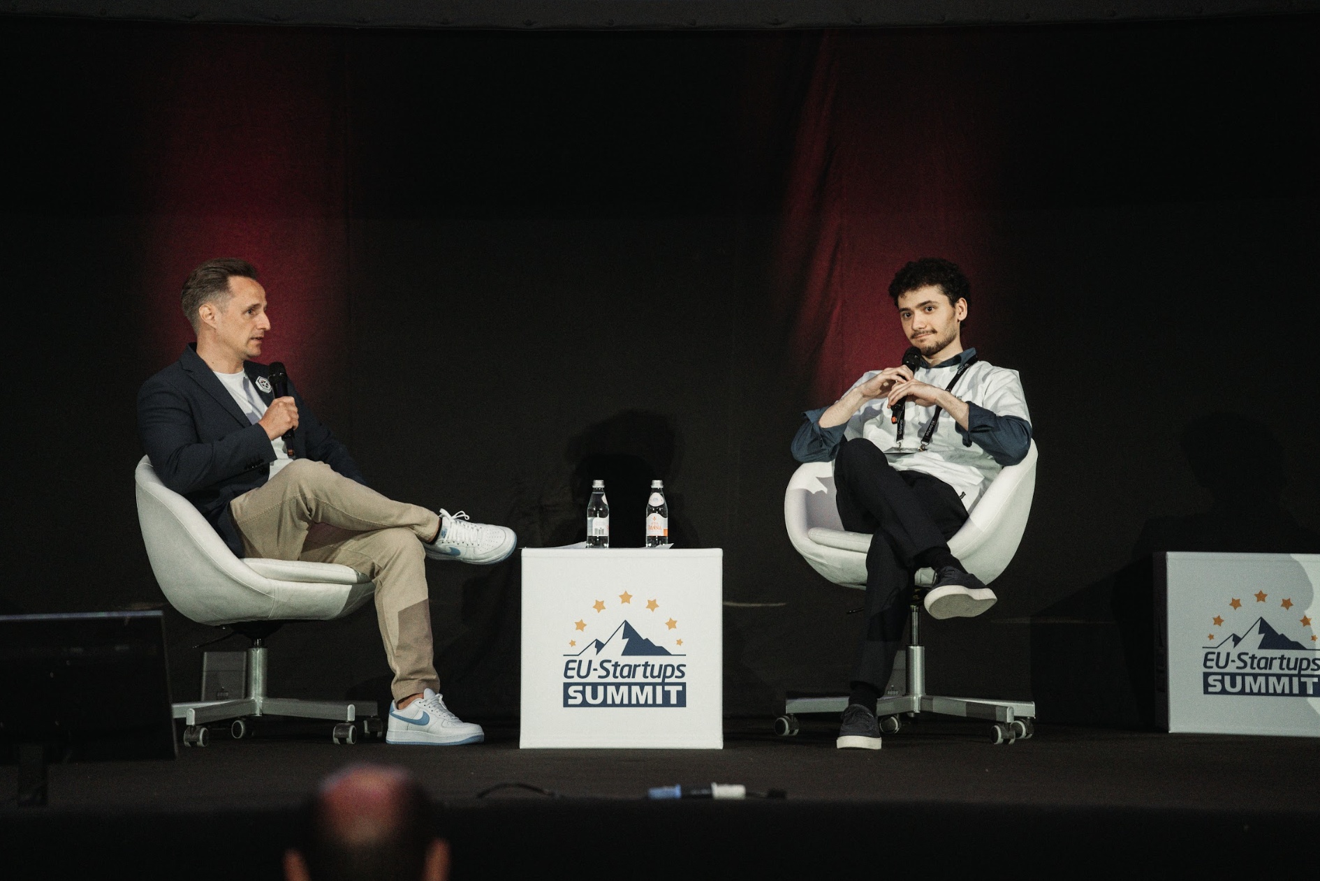 Kim Balle, seated at left, in conversation with Nodirbek Makhkamov at the EU-Startups Summit in 2026
