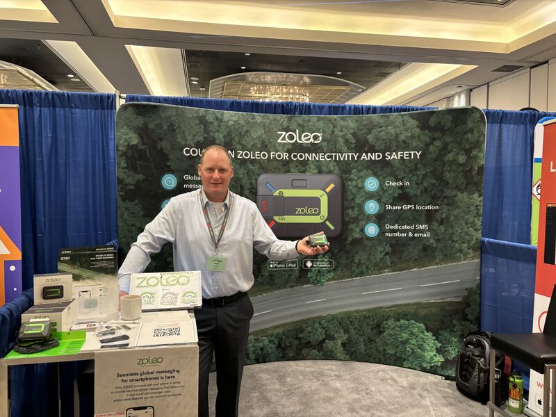 A Roadpost representative at a ZOLEO display during the Western Conference on Safety