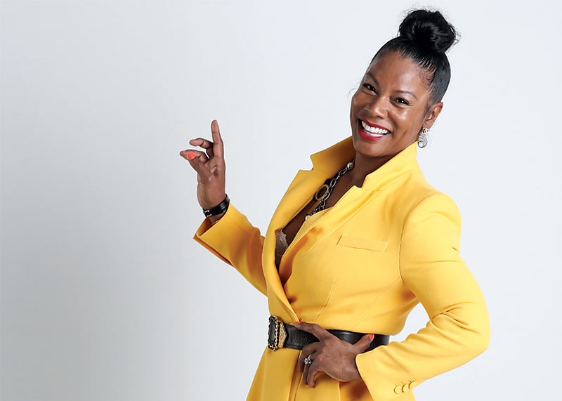 Kimberly Hairston-Hicks in a yellow suit, photographed for a Good Beauté feature