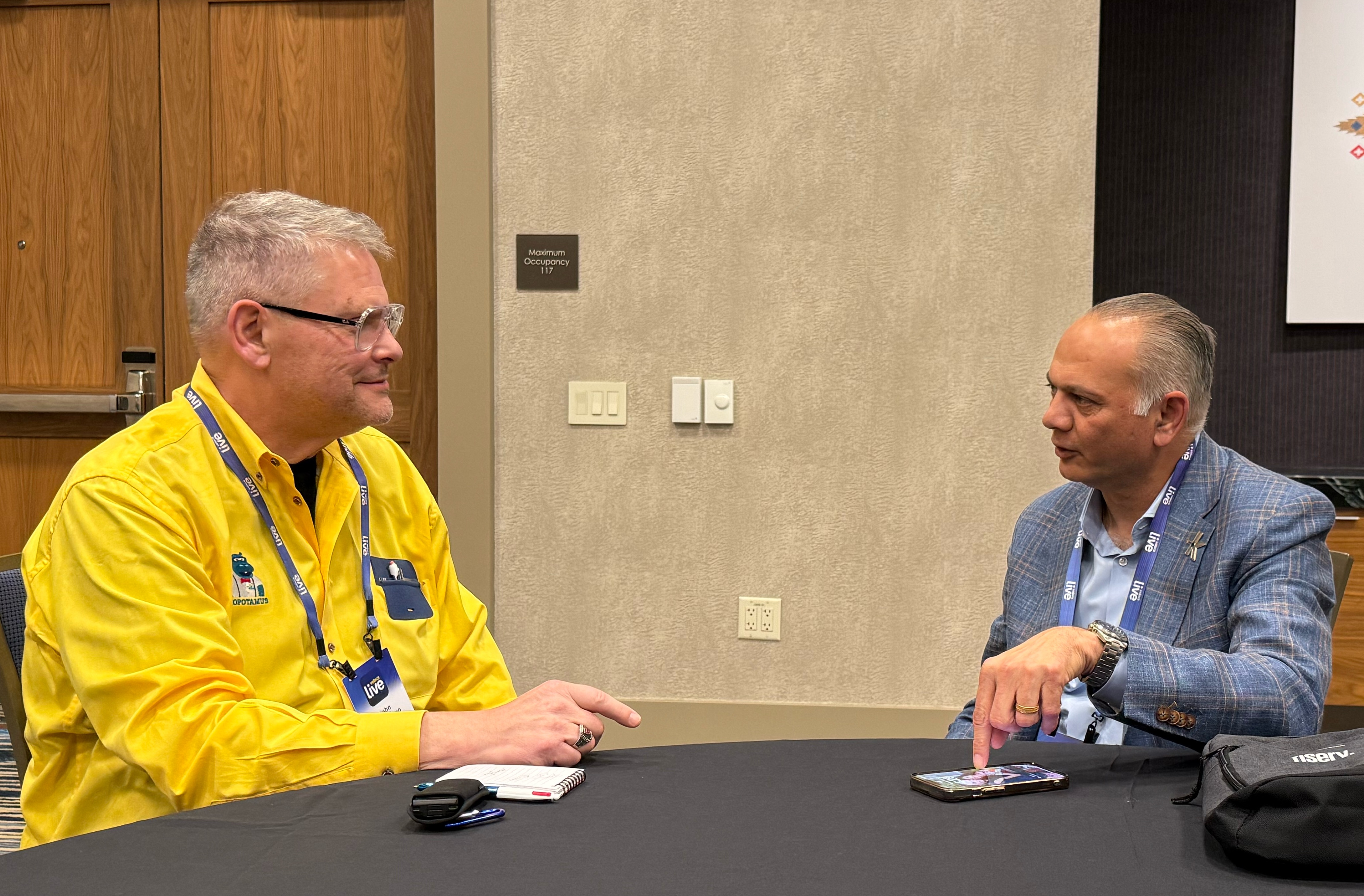 Kinective technology executive Nish Shah, at right, speaking with Finopotamus publisher John San Filippo