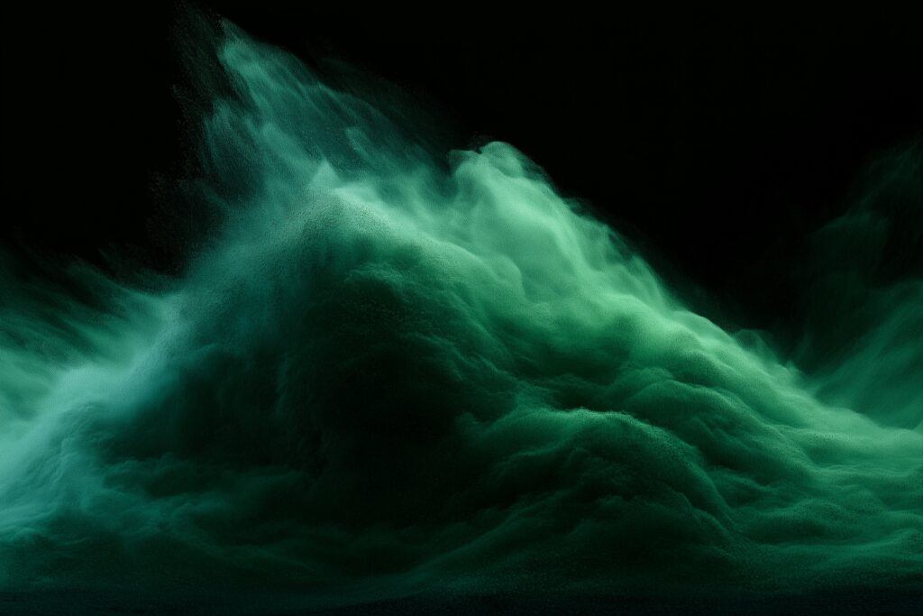 Green particles flowing across a dark background in Kinetix Health Group launch artwork