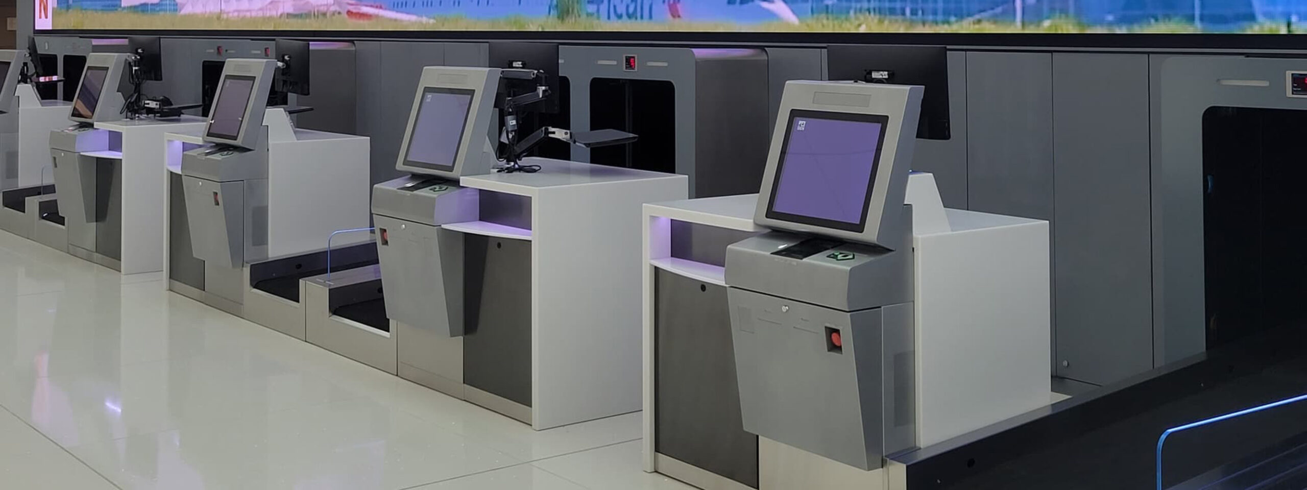 Airport check-in and baggage drop kiosk installation shown in KIOSK’s custom-project gallery