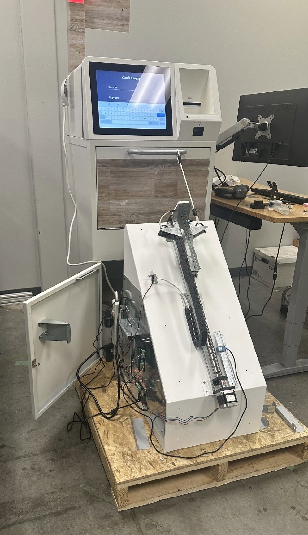 Returns kiosk attached to an in-house mechanical testing rig