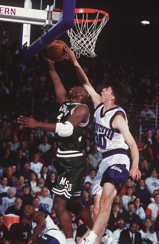 Kip Kirkpatrick contests a Michigan State shot while playing for Northwestern