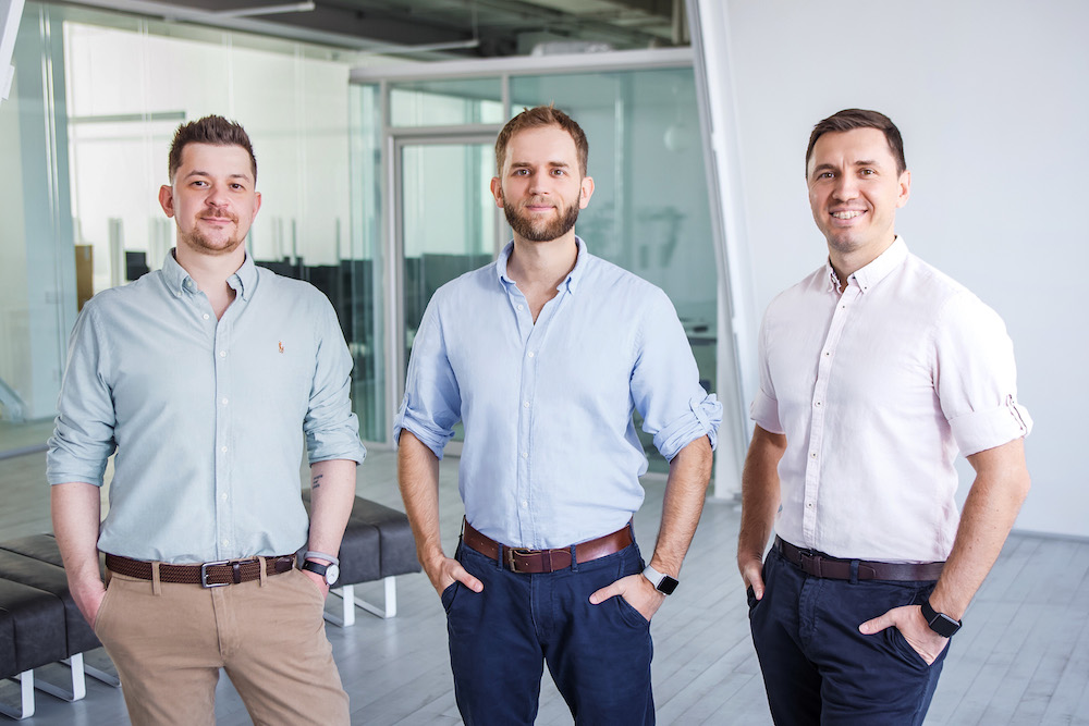 Preply co-founders Serge Lukyanov, Dmytro Voloshyn and Kirill Bigai standing together