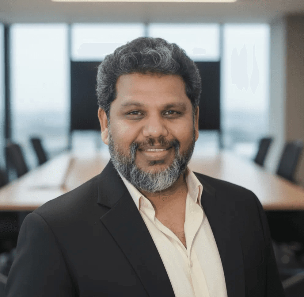 Kishore Pallamreddy seated in a modern office