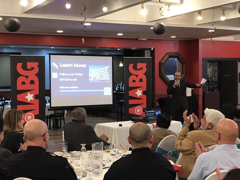 A speaker addresses seated attendees at the AIABG event with City of Dublin officials that Kishore Patel described hosting