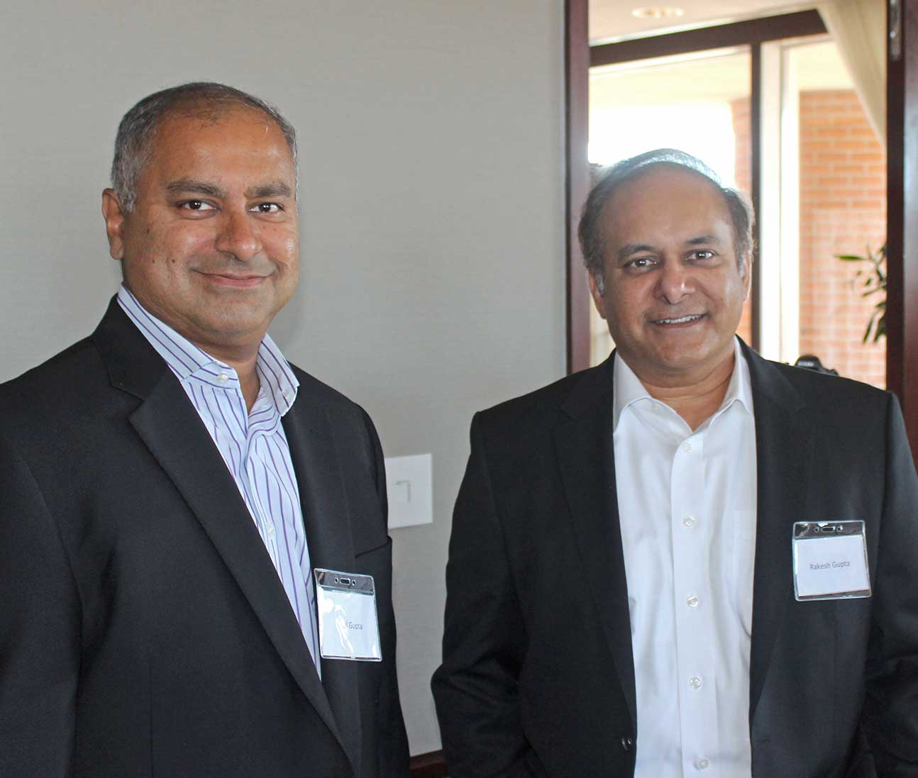 Neal Gupta, left, and Rakesh Gupta, right, photographed together