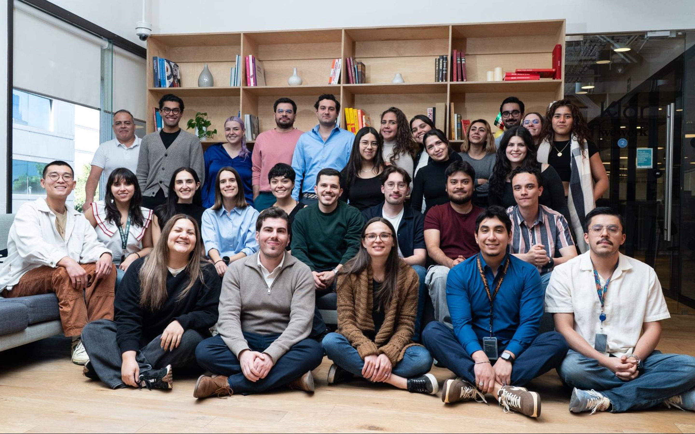 Klar colleagues gathered for a team photograph in an office