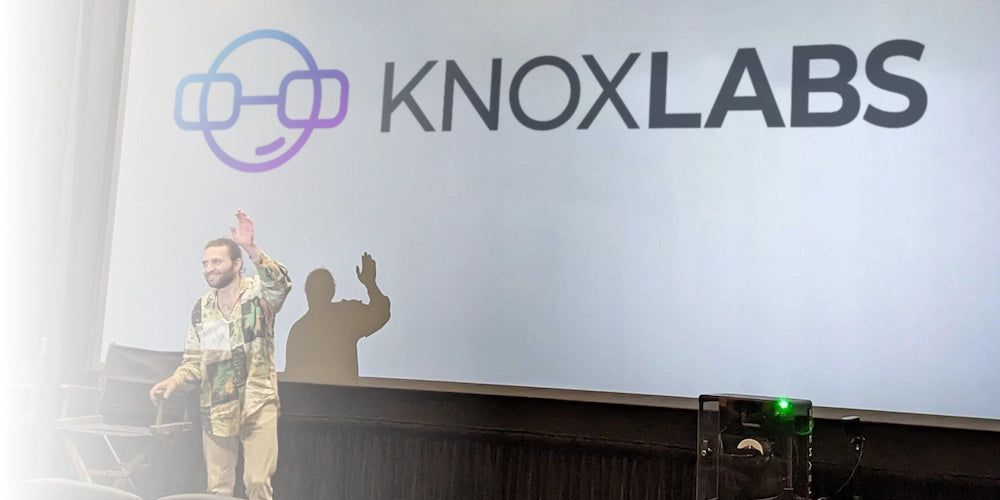The Knoxlabs founder presenting on stage in front of the company logo