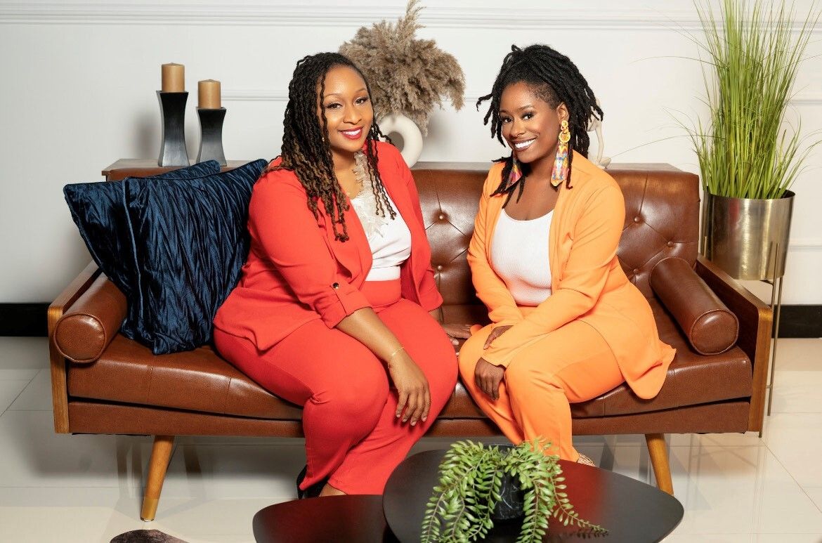 Markia Baker and business partner Navi seated together