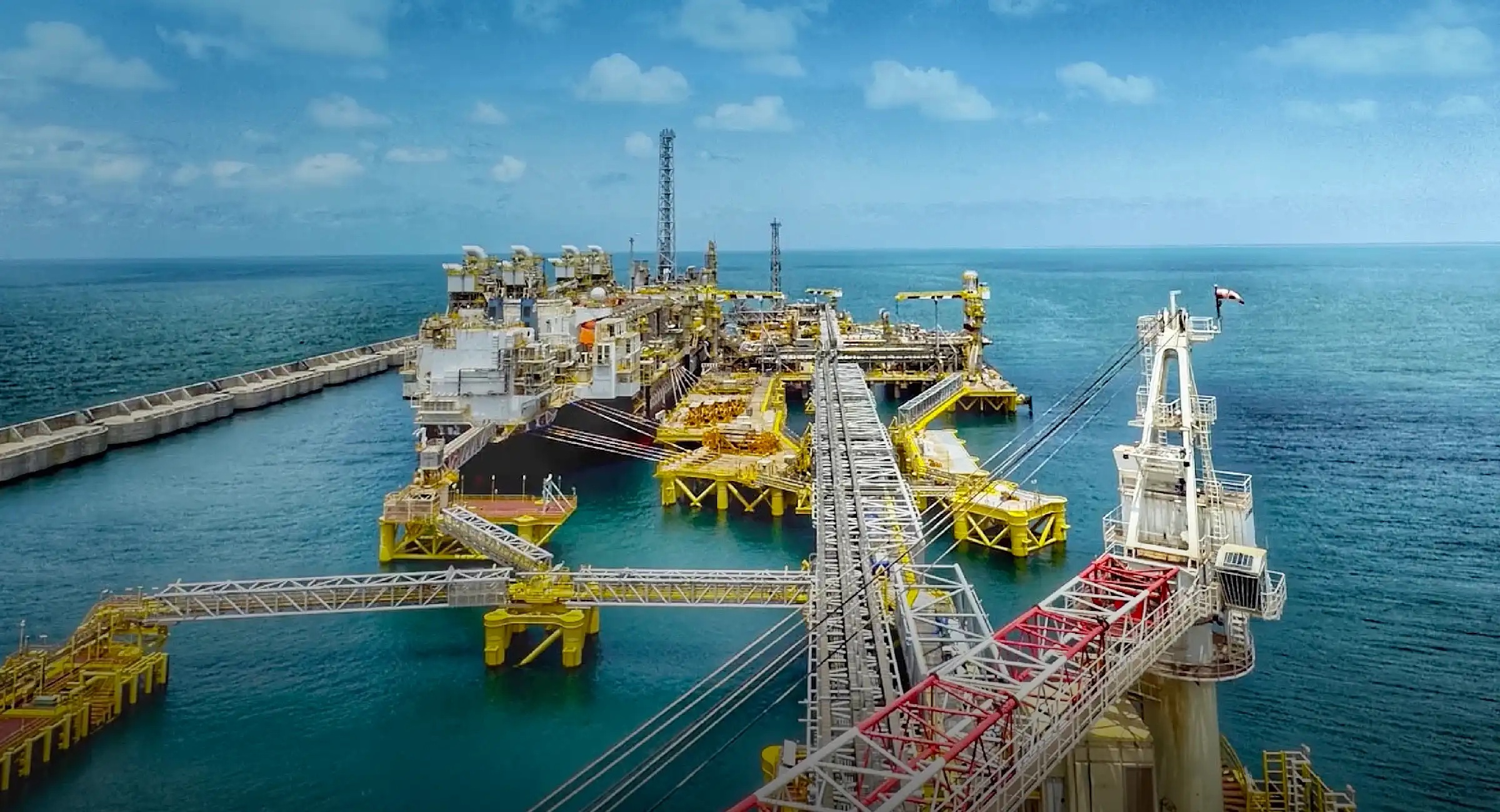 Offshore floating LNG infrastructure protected by a breakwater, shown on Kosmos Energy’s website