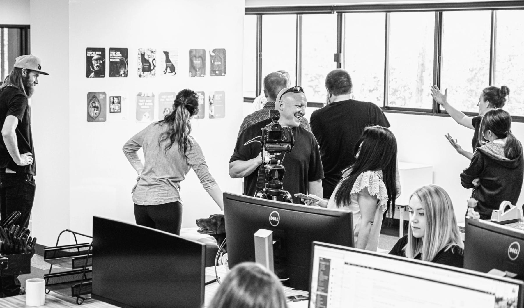KPS3 team members working around cameras and computers in the Reno office