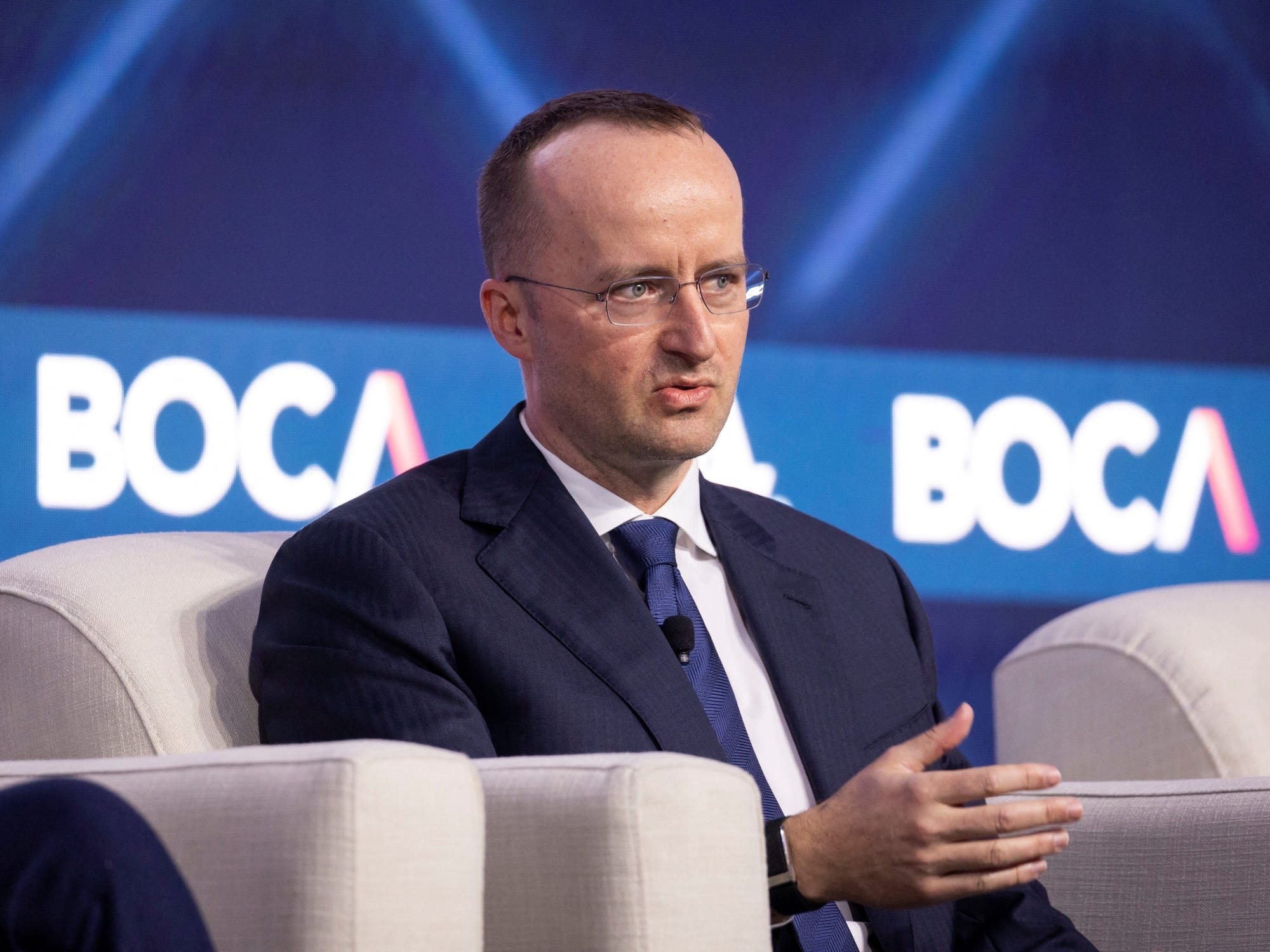 Kris Marszalek seated on stage at the BOCA conference