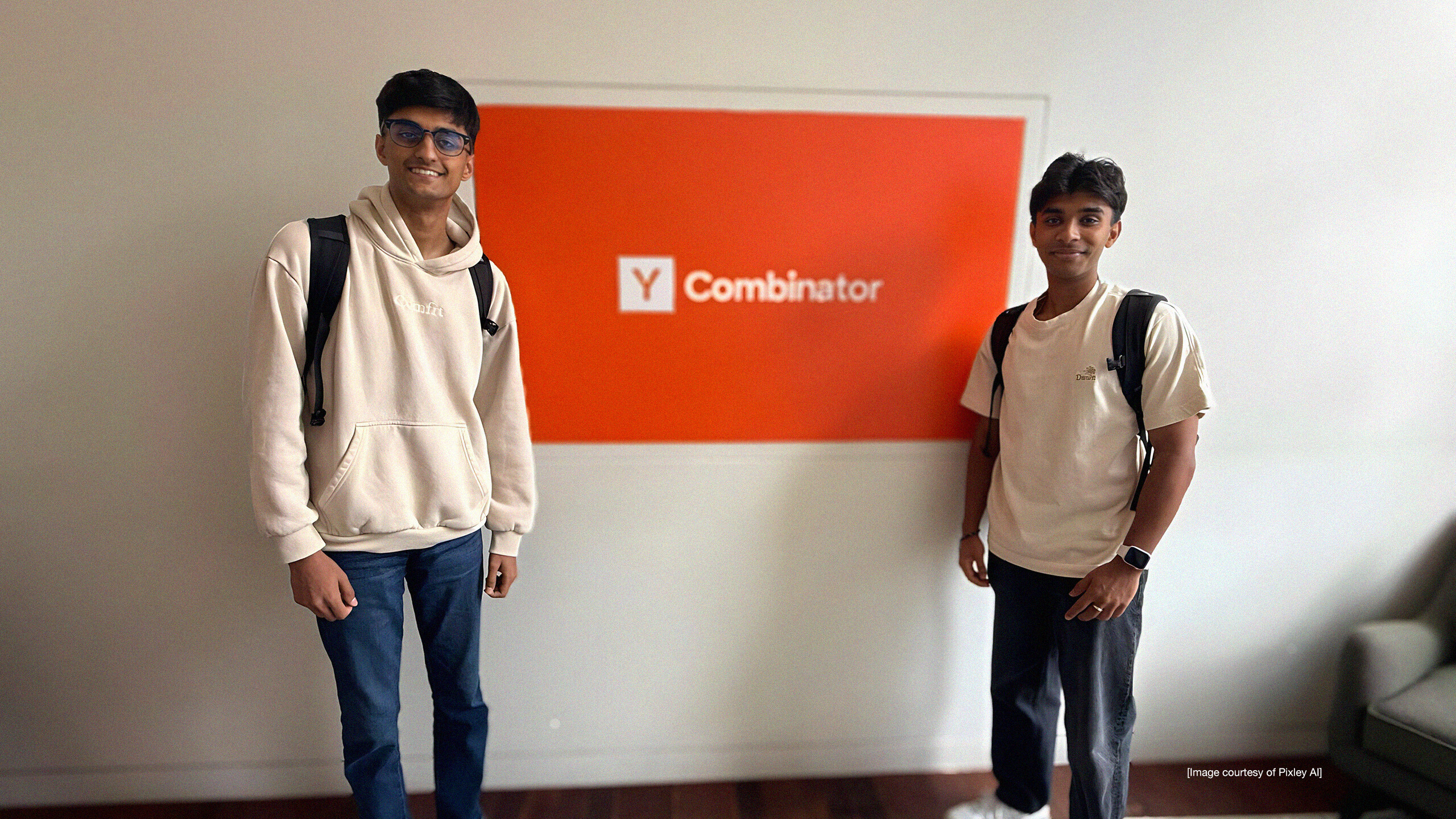 Krish Iyengar and Pranit Agrawal standing in front of the Y Combinator sign