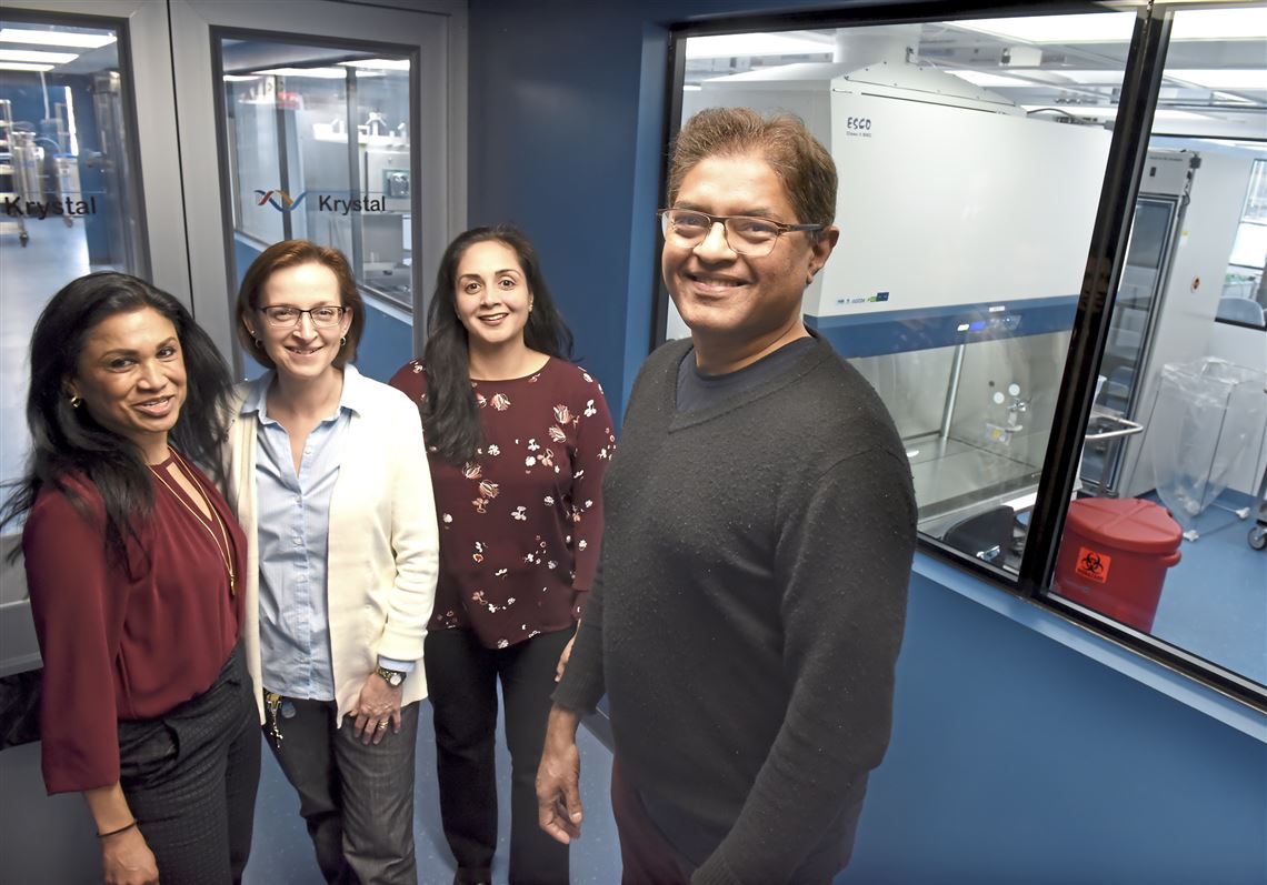 Members of the Krystal Biotech team inside a Pittsburgh laboratory